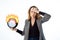 Deadline, procrastination. A shocked woman holds a burning clock. Isolated on a white background