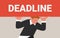 Deadline stress pressure, work problem, tired employee holding heavy deadline lettering