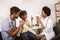 Deaf african american girl with ear implant at doctor`s office