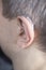 Deaf man hearing aid ear