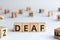 Deaf - word from wooden blocks with letters