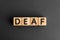 Deaf - word from wooden blocks with letters