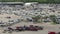 Dealer parking lot with big rig semi trucks for long haulage loaded with used cars ready for sale. Auction reseller