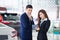 Dealership professional salesman negotiate and present. concept professionalism agreement contract leasing renting retail car