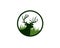 Dear head with antlers in front of meadow grass inside circle logo