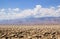 Death valley desert landscape with mountains rising in the background