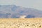 Death valley desert landscape with mountains rising in the background