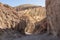 Death valley - Golden Canyon trailhead with scenic view of colorful geology of multi hued Amargosa Chaos rock formations, USA