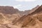 Death valley - Golden Canyon trailhead with scenic view of colorful geology of multi hued Amargosa Chaos rock formations, USA