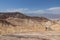 Death Valley - Man with scenic view Badlands of Zabriskie Point, Furnace creek, Death Valley National Park, California