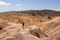 Death Valley - Man with scenic view Badlands of Zabriskie Point, Furnace creek, Death Valley National Park, California