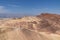 Death Valley - Man with scenic view of summit peak Manly Beacon seen from Zabriskie Point, Badlands, Furnace creek, Death Valley