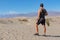 Death Valley - Rear view of man looking at Mesquite Flat Sand Dunes in Death Valley National Park, California, USA.