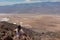 Death Valley - Rear view of woman overlooking the Salt Badwater Basin and Panamint Mountains seen from Dante\\\'s View