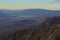 Death Valley Vista from top of Dante`s View during Thanksgiving Sunset. Salt flats look like lake or clouds. Purple mountain range
