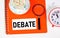 Debate. Text label in the folder. Disagreements on issues, conflict resolution.