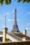 The Debilly footbridge and the Eiffel tower in Paris, France, on a sunny morning