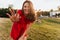 Debonair caucasian woman smiling to camera in sunny day. Outdoor photo of cheerful beautiful girl in