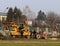 Debowiec/Poland - March 27, 2018: Spring cleaning of green territory in the city. Tractor and excavator for upgrading the green pl