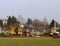 Debowiec/Poland - March 27, 2018: Spring cleaning of green territory in the city. Tractor and excavator for upgrading the green pl