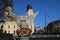 Debrecen, Hungary - 22. January 2023: Phoenix statue in Debrecen. Great Church in the background.