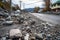 debris and rocks scattered on damaged road