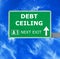 DEBT CEILING road sign against clear blue sky
