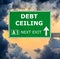 DEBT CEILING road sign against clear blue sky