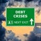 DEBT CRISES road sign against clear blue sky