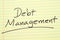 Debt Management On A Yellow Legal Pad