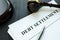 Debt Settlement agreement papers with gavel