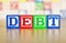 Debt Spelled Out in Alphabet Building Blocks