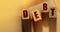 DEBT word made with wooden blocks. Liability unprofitable business or personal loss concept