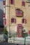 DEC 2022 - Malta Traditional balconies red wooden and english red phone box in a Valletta street - luxury mansions baroque style