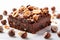 Decadent brownie slice adorned with hazelnuts, on pristine white canvas