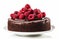 Decadent chocolate cake adorned with a crown of luscious raspberries