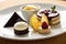 A decadent dessert platter showcasing a trio of mouth-watering treats. (Generative AI)
