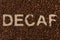 Decaf concept written on coffee beans