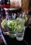 Decanters of refreshing cool water with cucumber and lemon in the bar at the entrance.