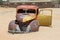 Decayed car in the desert, Namibia