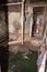 Decayed and flooded slum house