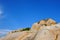 Decayed granite under blue sky