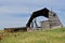 Decaying rotting old hip roofed barn