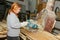 December 1, 2018: girl saws boards using an end saw in a woodworking workshop. Yoshkar-Olya. Russia