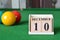 December 10, number cube with balls on snooker table, sport background.