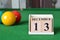 December 13, number cube with balls on snooker table, sport background.