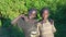 December, 2019. Africa, Uganda, a village near Entebbe. Two poor boys, two friends. The boy waves his hand