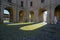 December 2020 Parma, Italy: Courtyard of the the Palazzo della Pilotta with Heads exhibition.View from Palazzo Pilotta arch in sun