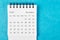The December 2022 Monthly desk calendar for 2022 year on blue background