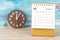 The December 2022 Monthly desk calendar for 2022 year and clock